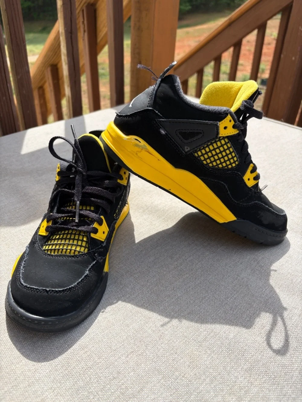 Air Jordan 4 Retro “Thunder” in size 2.5Y GUC.